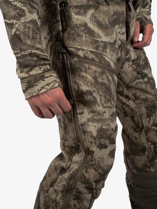 Full length leg zippers and flexible leg panels