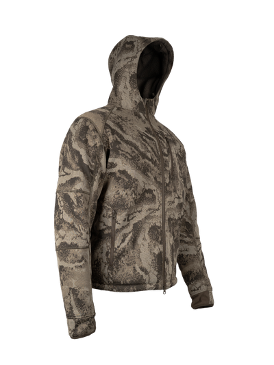 Three quarter view of the FareWinds Merino FlexTec L2 Jacket in S-18 Camo, hood up, showing the sherpa lined hood, the full front zip and the zippered sleeve pocket.