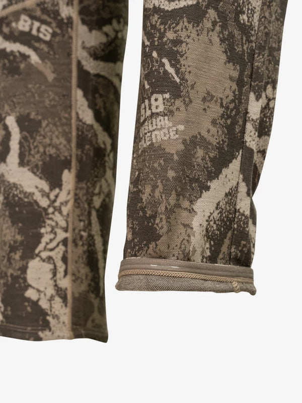 Elastic gripper tape on lower leg cuff